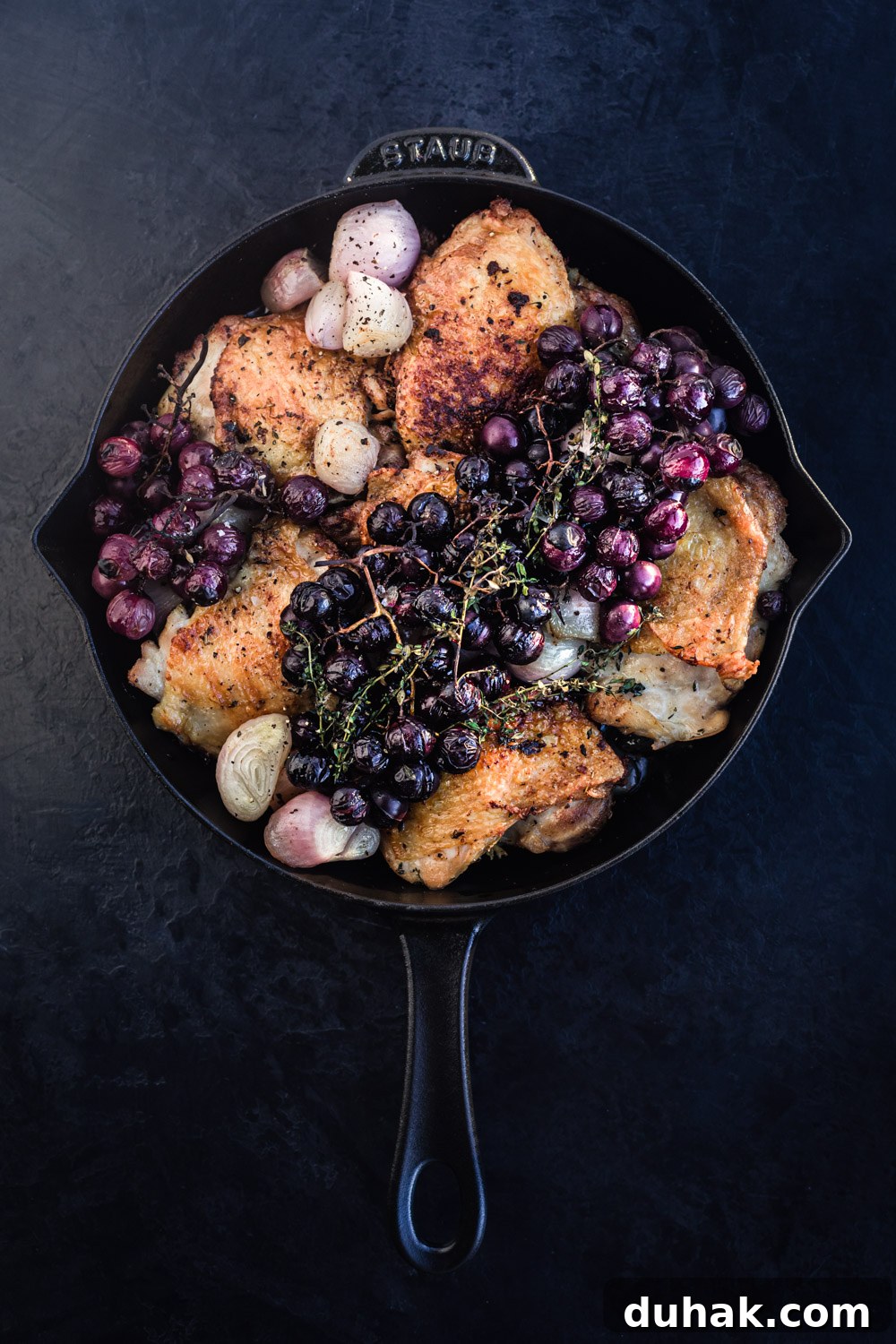 Thyme roasted chicken with caramelized shallots and grapes, just out of the oven and all done.