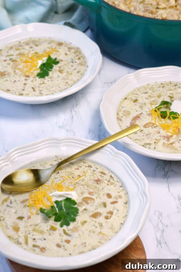 Creamy White Chicken Chili Recipe — Hearty Crockpot & Stovetop Options 2 3 white bowls filled with white chicken chili