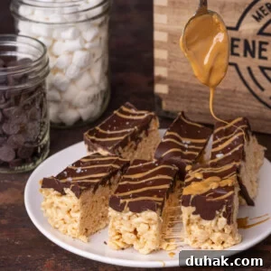 Drizzling extra peanut butter on top of chocolate peanut butter rice krispies treats.