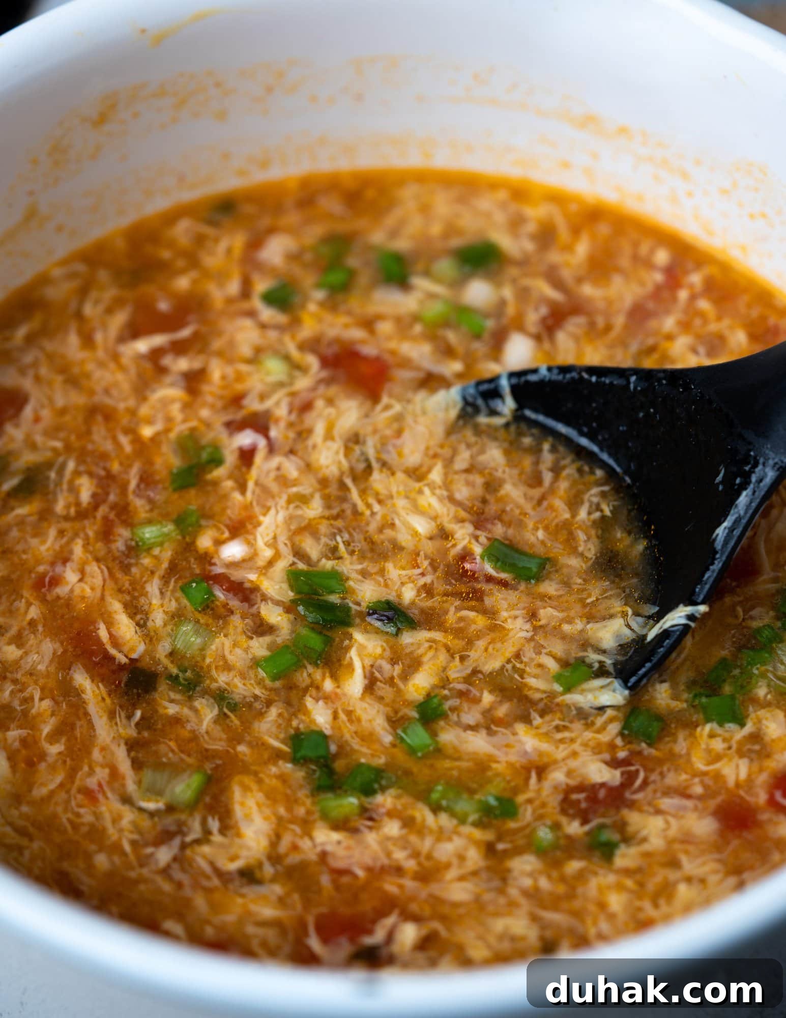 Quick Tomato and Egg Drop Soup Recipe for Comforting Meals 3 Pot of Egg Drop Soup with tomatoes.