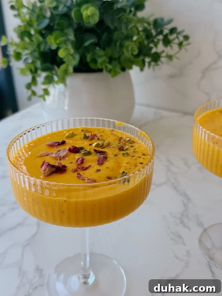 mango lassi recipe with dried roses on top