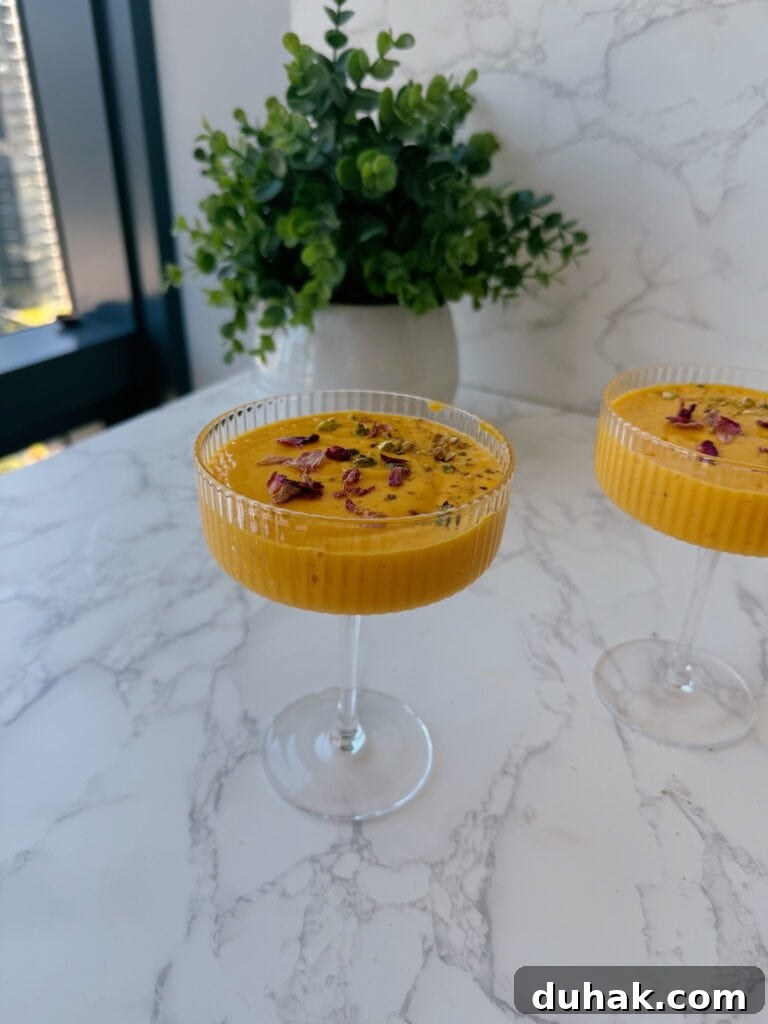 mango lassi recipe garnished with rose petals