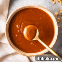 Hoisin Peanut Sauce Recipe for Stir-Fries, Dipping & Marinades 11 A teaspoon of creamy peanut hoisin sauce scooped from a small bowl.