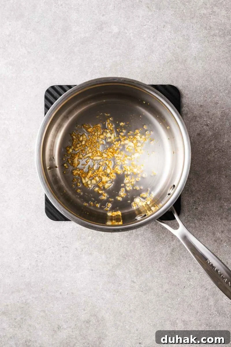 Hoisin Peanut Sauce Recipe for Stir-Fries, Dipping & Marinades 5 Minced garlic cooked in a saucepan until golden and fragrant.