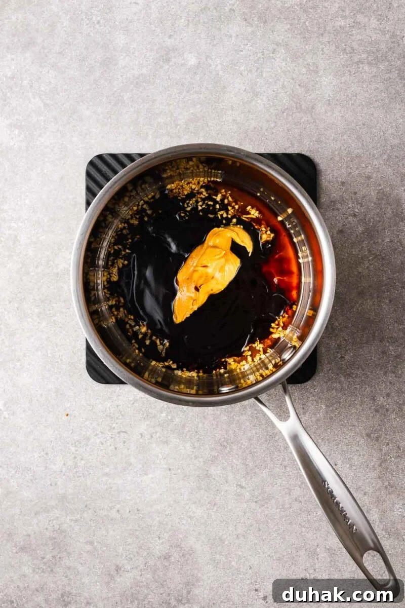 Hoisin Peanut Sauce Recipe for Stir-Fries, Dipping & Marinades 6 Peanut butter and hoisin dipping sauce ingredients in a saucepan.