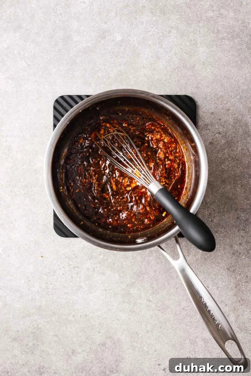 Hoisin Peanut Sauce Recipe for Stir-Fries, Dipping & Marinades 7 Mixing hoisin dipping sauce over medium heat.
