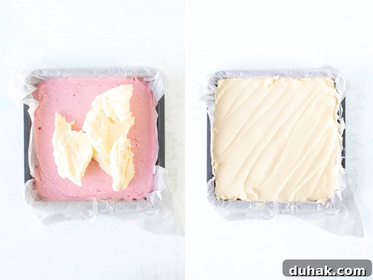 Adding vanilla frosting on top of strawberry layer of strawberry ice cream cake