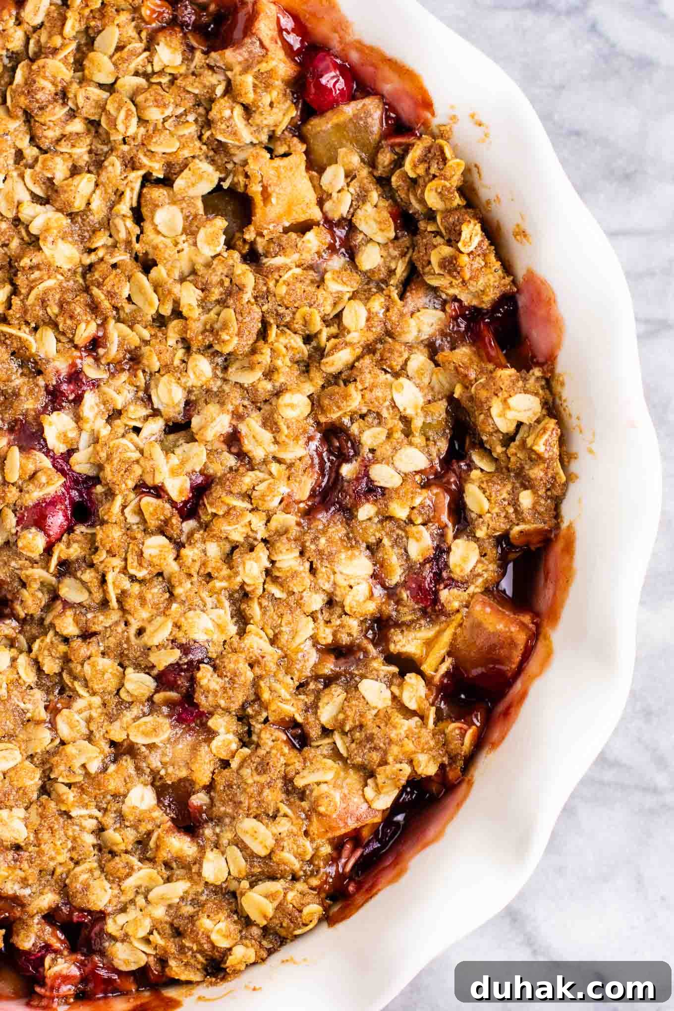 Cranberry Apple Crisp with Warm Cinnamon Crumble 3 fresh cranberry apple crisp in a pie dish