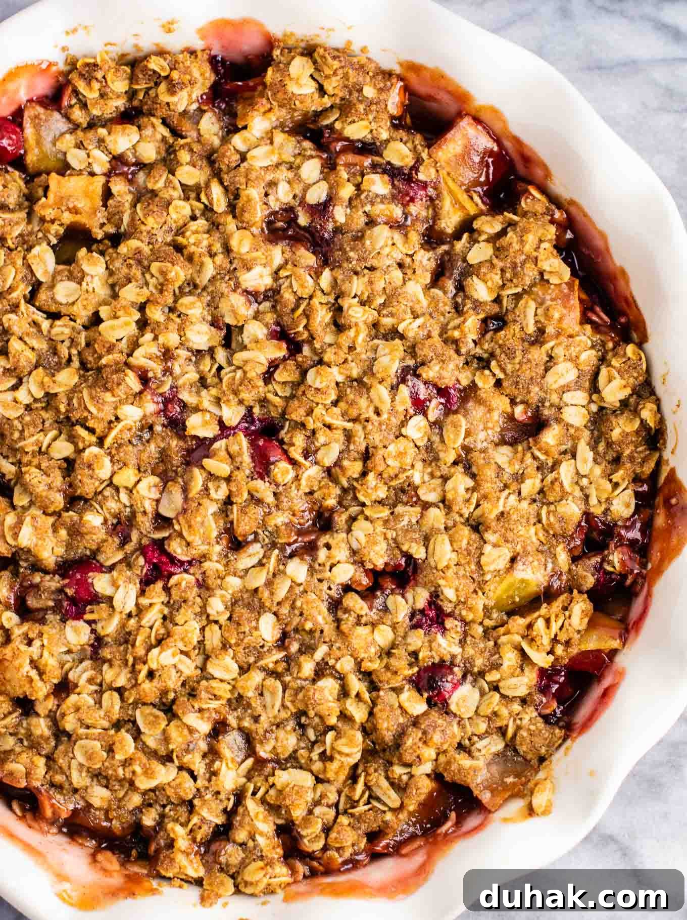 Cranberry Apple Crisp with Warm Cinnamon Crumble 5 cranberry apple crisp in a pie plate