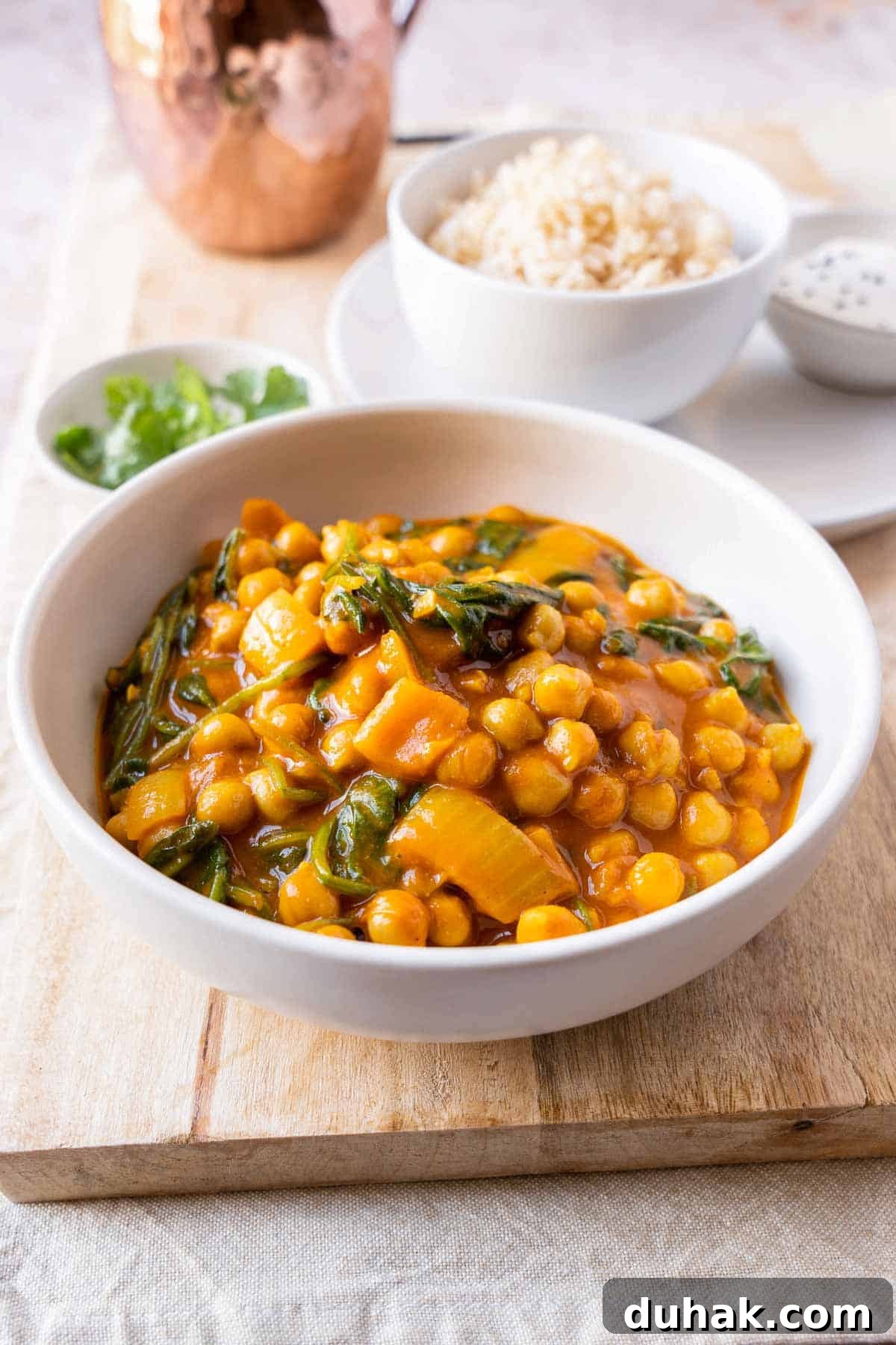 Chickpea and spinach curry plated in a bowl.