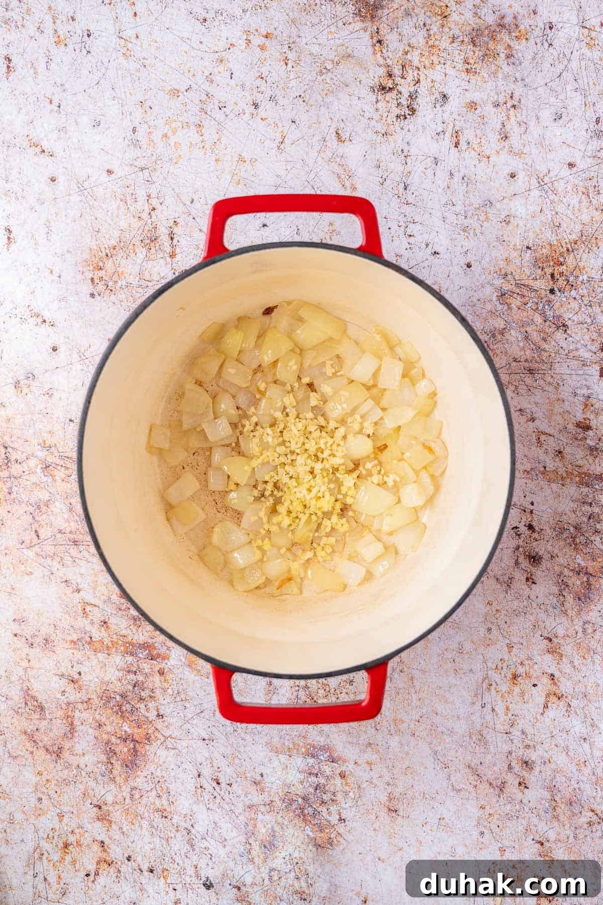 Garlic and ginger added to the pot.