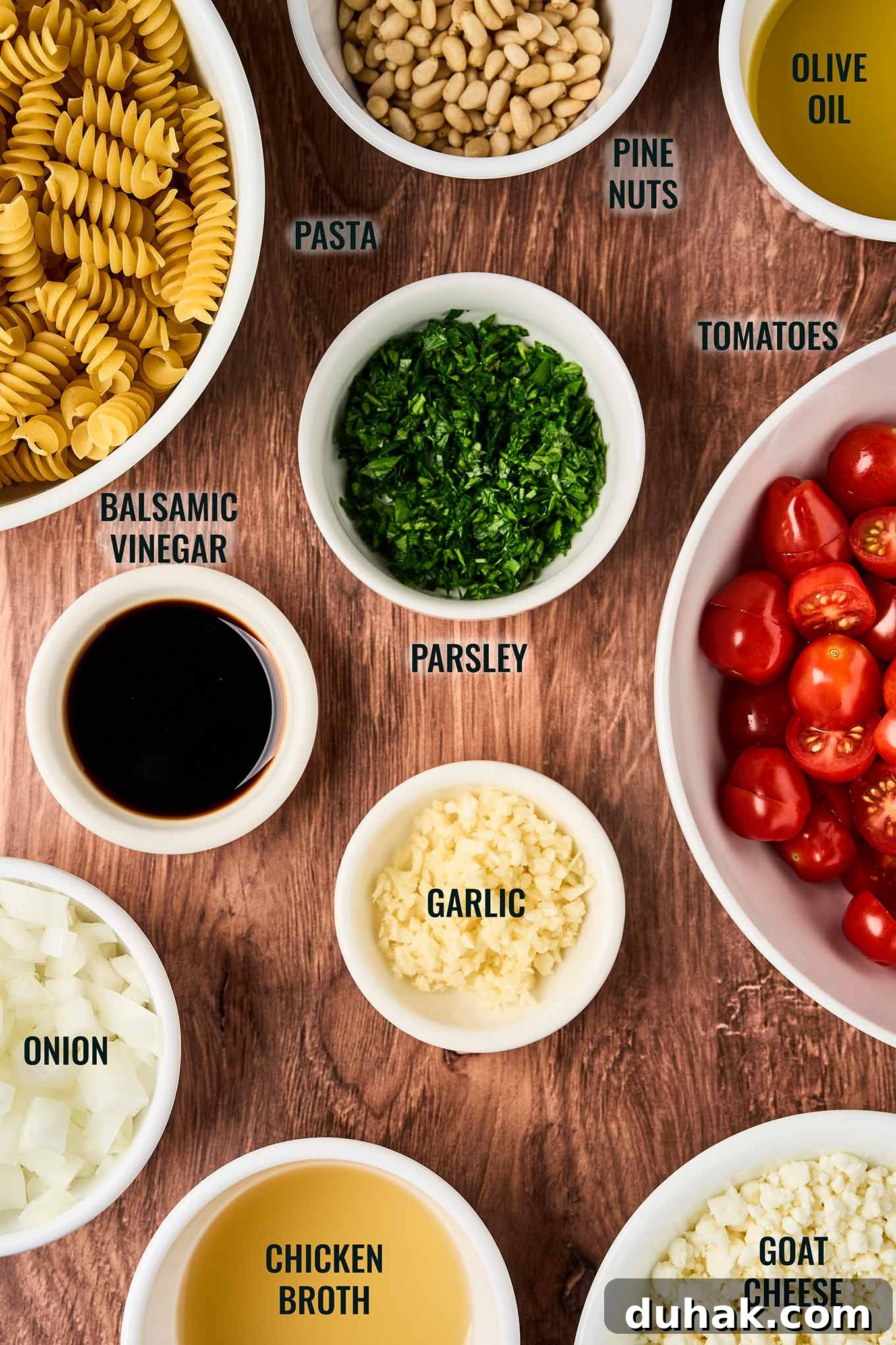 Creamy Goat Cheese Pasta with Fresh Cherry Tomatoes 3 Ingredients for goat cheese pasta with fresh tomatoes including rotini, cherry tomatoes, goat cheese, pine nuts, garlic, onion, parsley, balsamic vinegar, olive oil, and chicken broth.