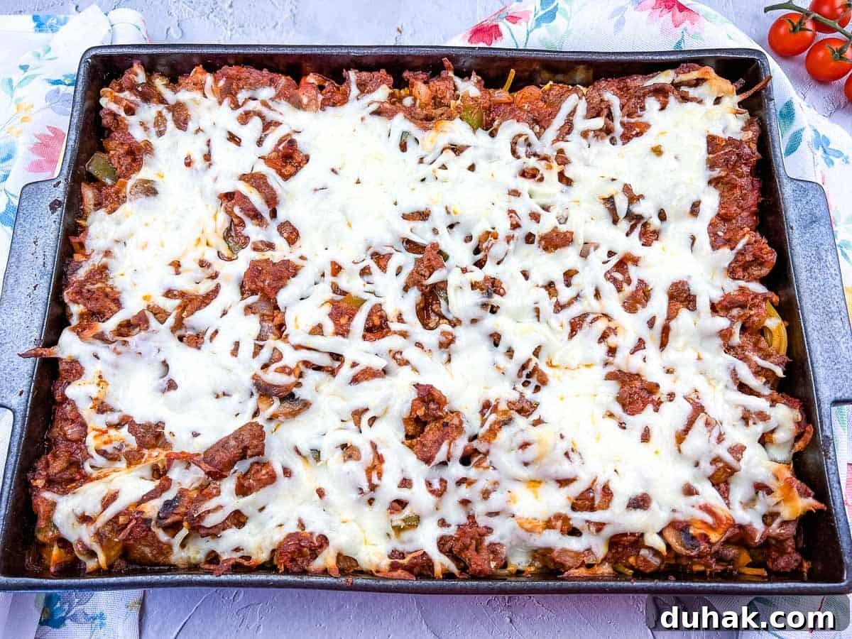 37 Comfort Food Recipes That Keep Reappearing on Menus 28 Spaghetti with meat and cheese in a baking dish.