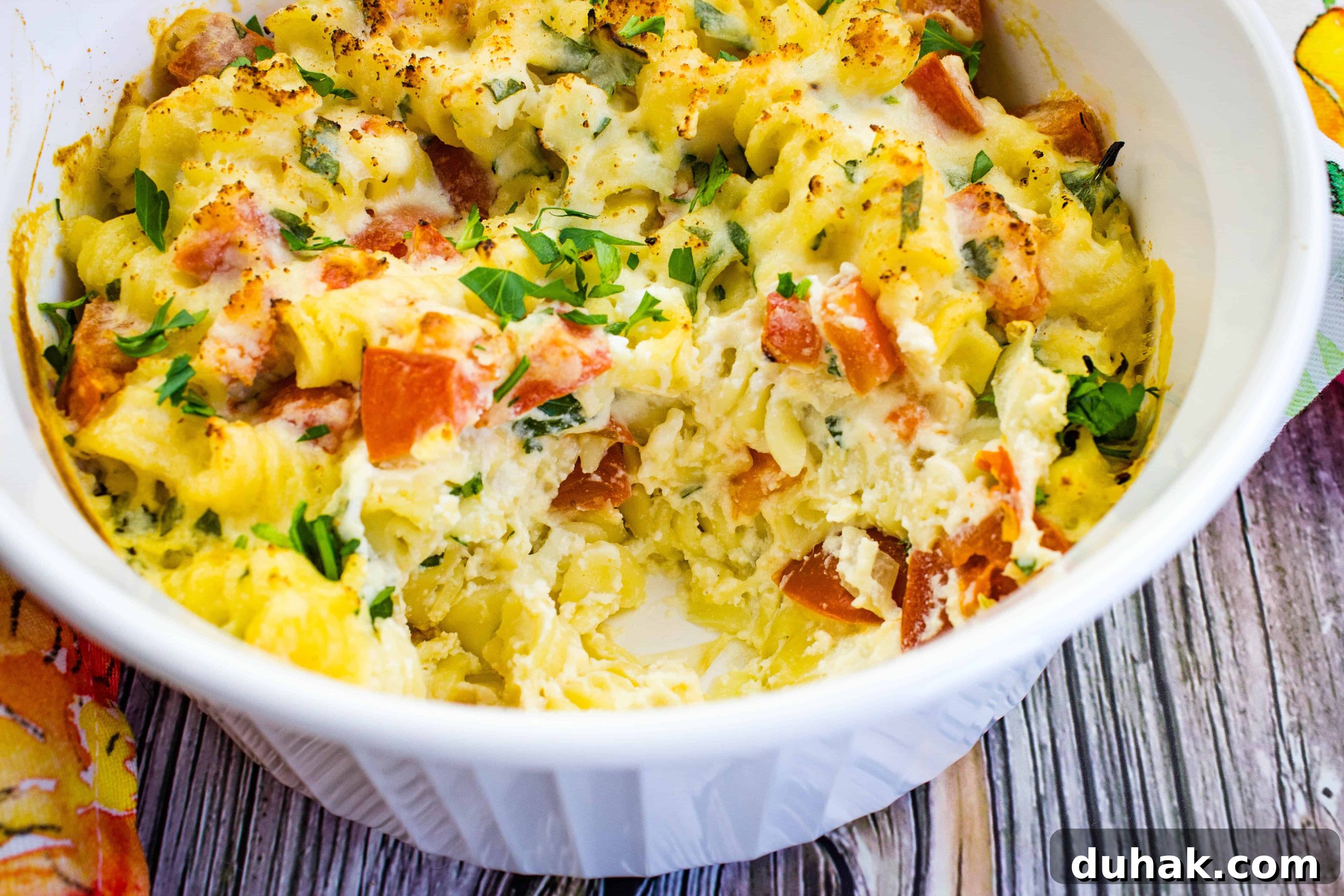 37 Comfort Food Recipes That Keep Reappearing on Menus 32 Ricotta and Tomato Pasta in a white bowl.