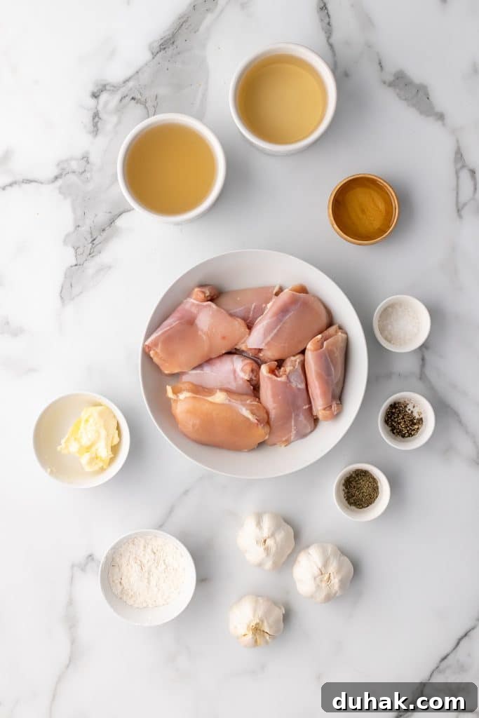 Pan-Seared Chicken Thighs with Creamy Garlic Gravy 4 overhead image showing the measured ingredients needed to make pan seared chicken thighs with garlic gravy