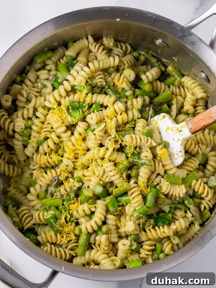 Creamy Salmon Pesto Pasta with Lemon Zest 14 lemon zest added to pasta