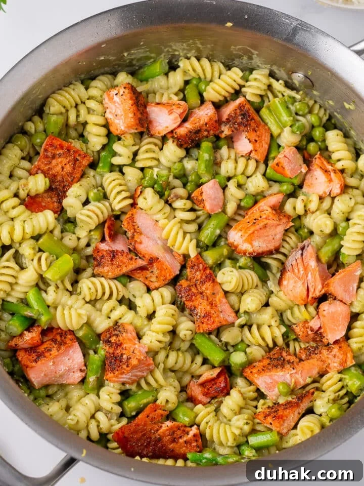Creamy Salmon Pesto Pasta with Lemon Zest 15 salmon chunks added to pesto pasta