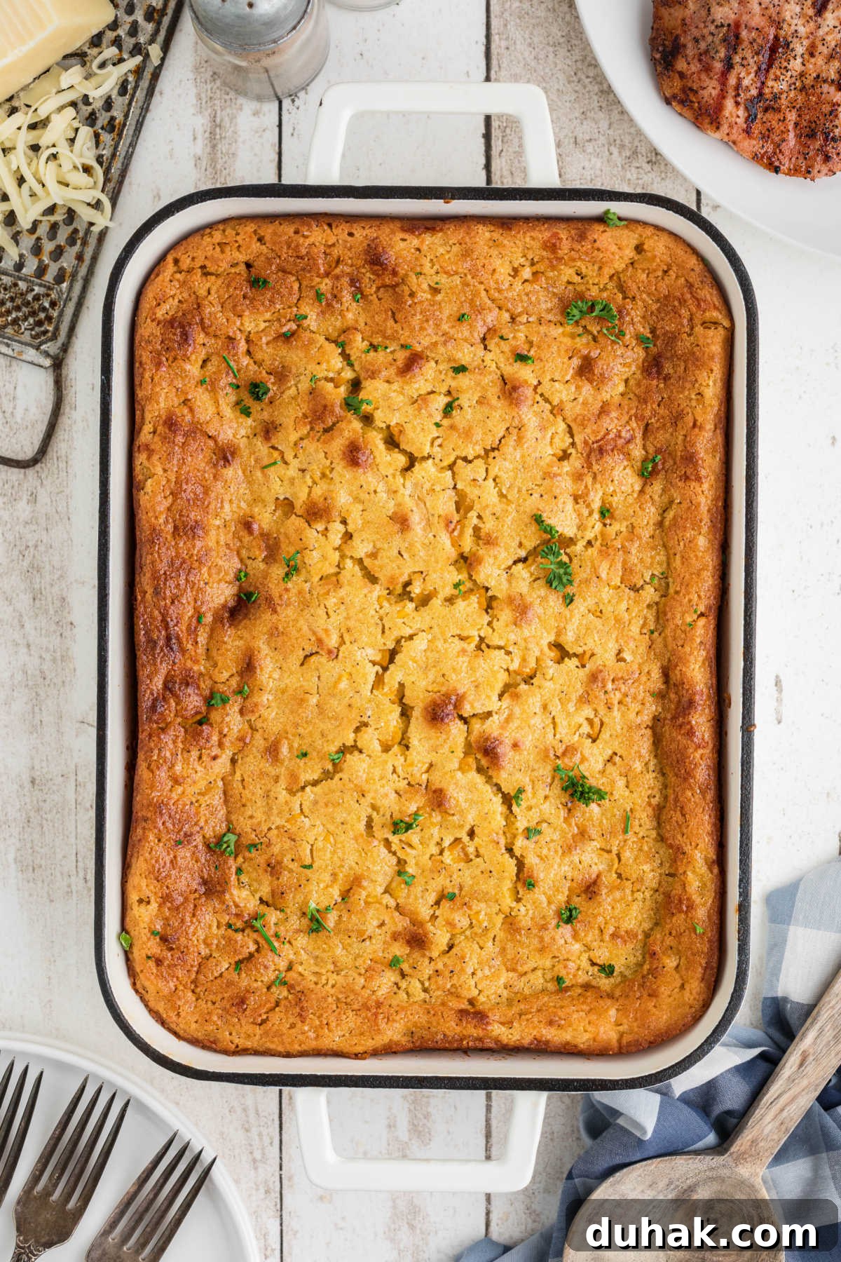Overhead view of a dish of cornbread pudding.