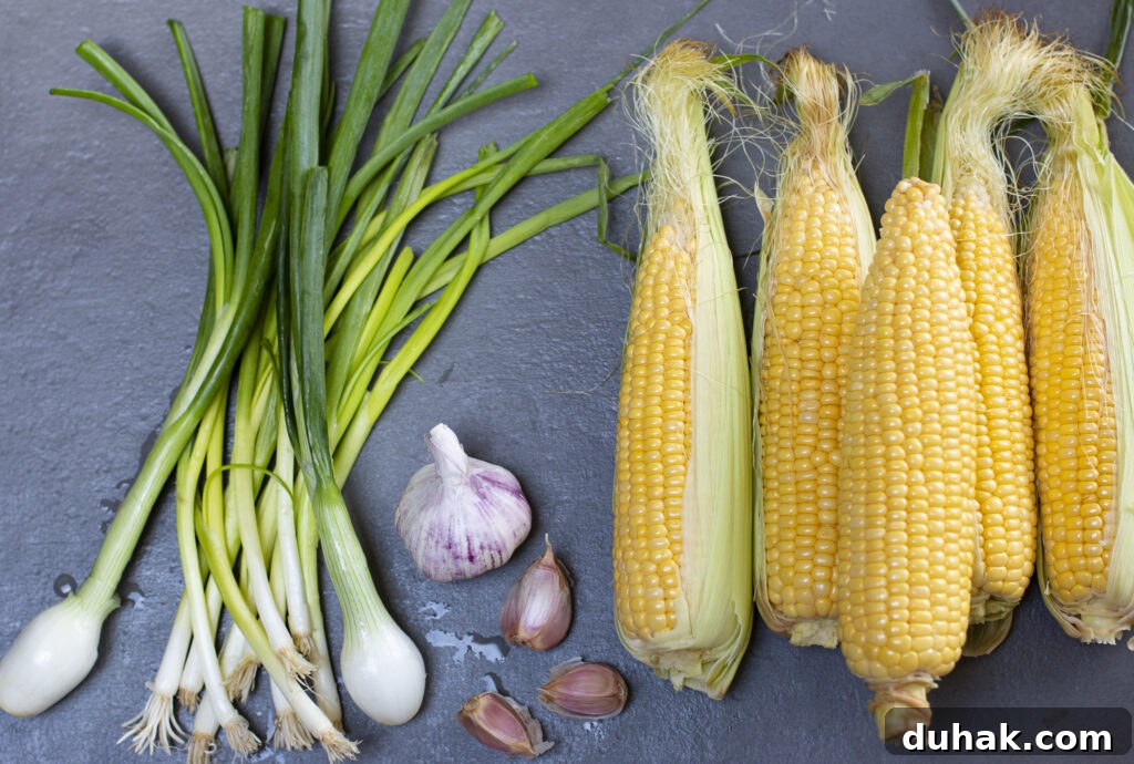 Five ears of corn with scallions and garlic