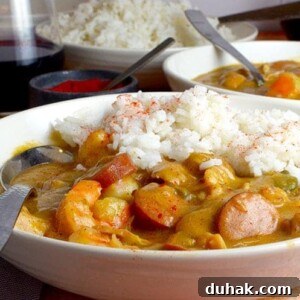 Classic Sausage and Chicken Gumbo Recipe — Hearty Creole Stew 10 Sausage and Chiken Gumbo with rice in a bowl