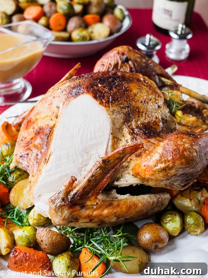 Roast turkey with slice cut off to expose cooked breast.
