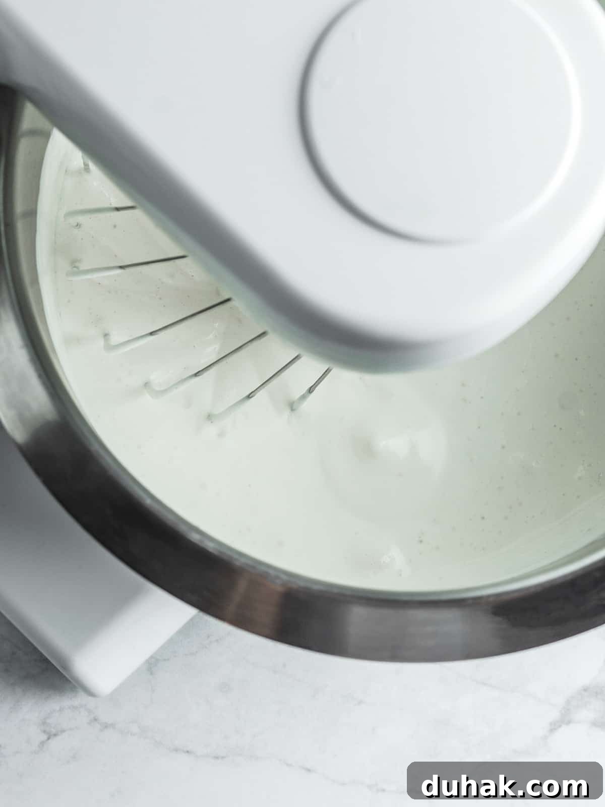 Chantilly cream at the foaming stage in a bowl