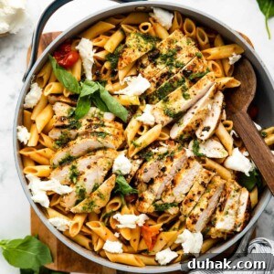 Tomato basil chicken pasta in a pan.