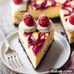 White chocolate raspberry cheesecake slice.