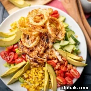 BBQ chicken salad on a white plate.