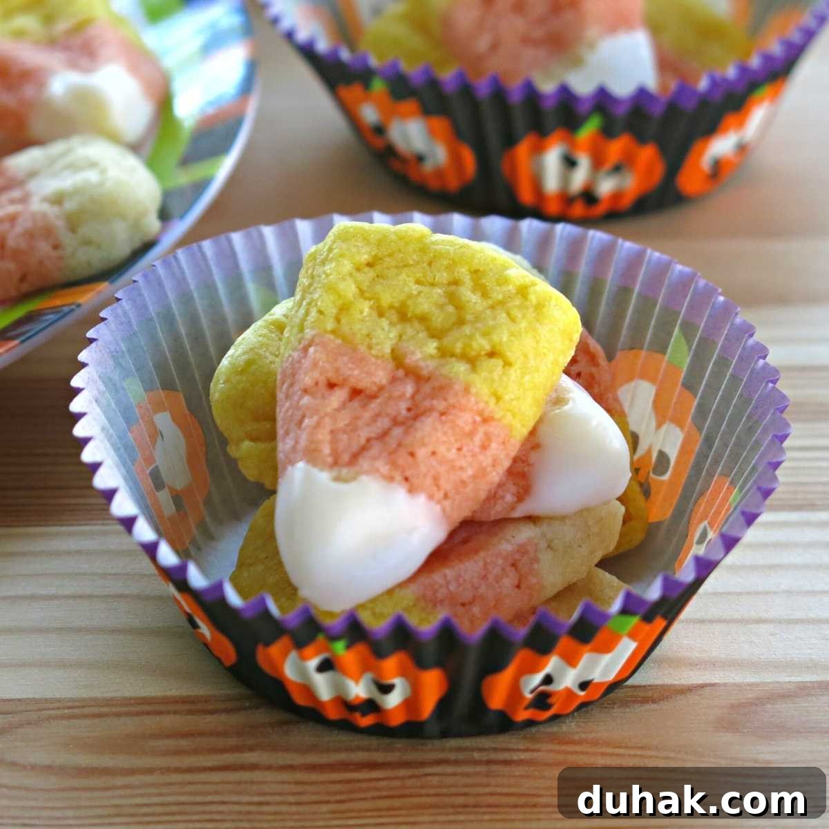 Vegan Candy Corn Sugar Cookies in a paper insert.