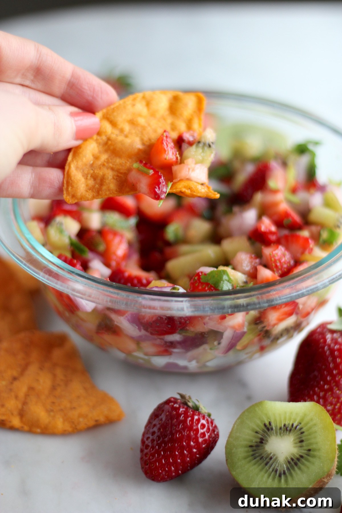 Strawberry Kiwi Fruit Salsa - a light, refreshing salsa that is sweet, savory, and a little spicy! Makes a perfect appetizer or snack! | fedandfulfilled.com