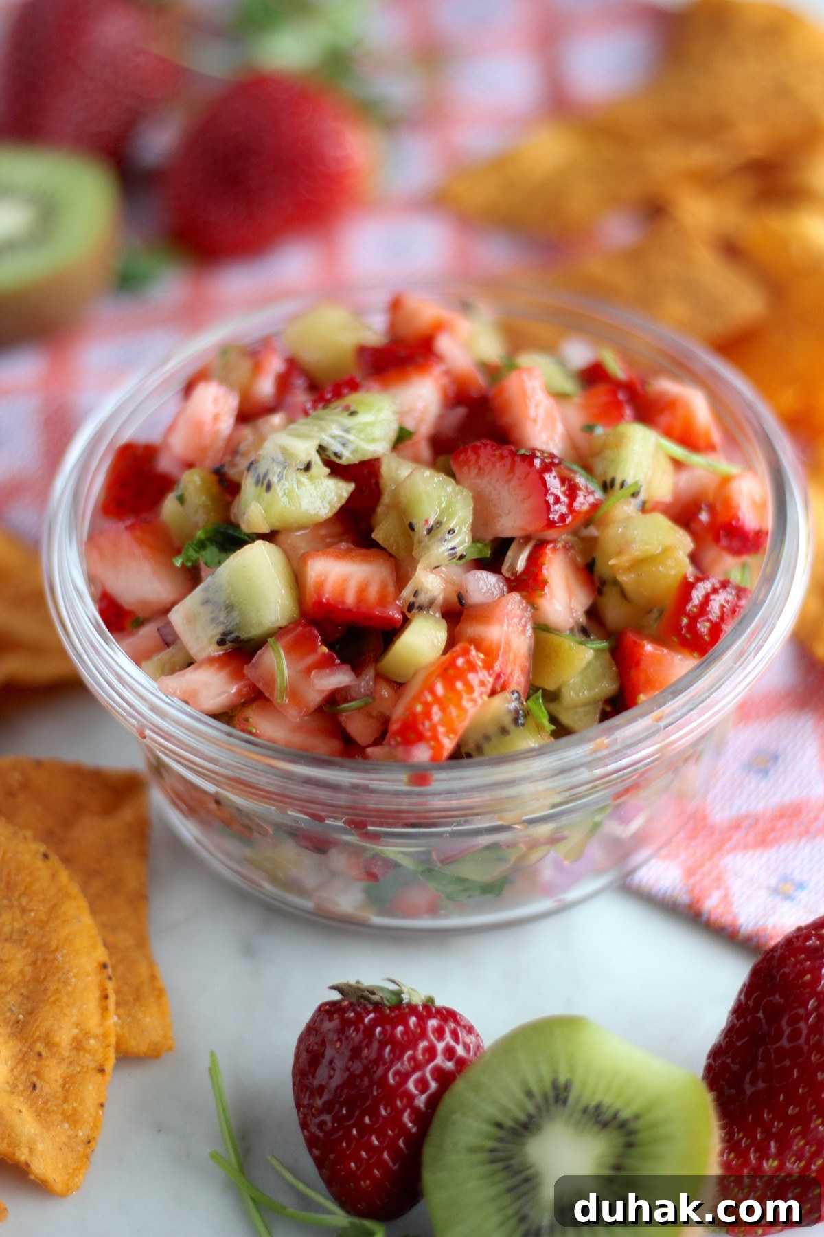 Strawberry Kiwi Fruit Salsa - a colorful, fresh salsa full of fruits, cilantro, lime, and green chilies! Makes a delicious and healthy appetizer! | fedandfulfilled.com