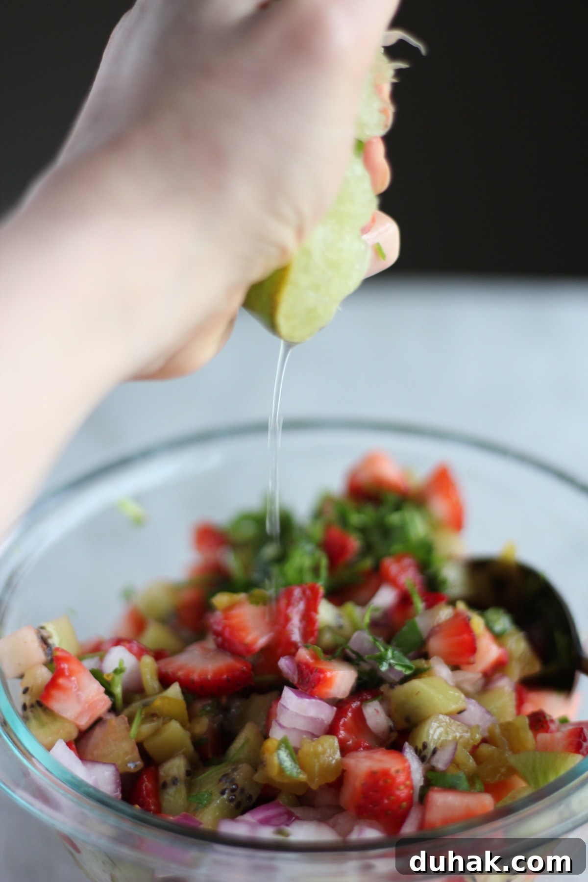 Strawberry Kiwi Fruit Salsa - fresh fruits are combined with classic salsa ingredients like lime and cilantro to make a colorful, healthy appetizer! | fedandfulfilled.com