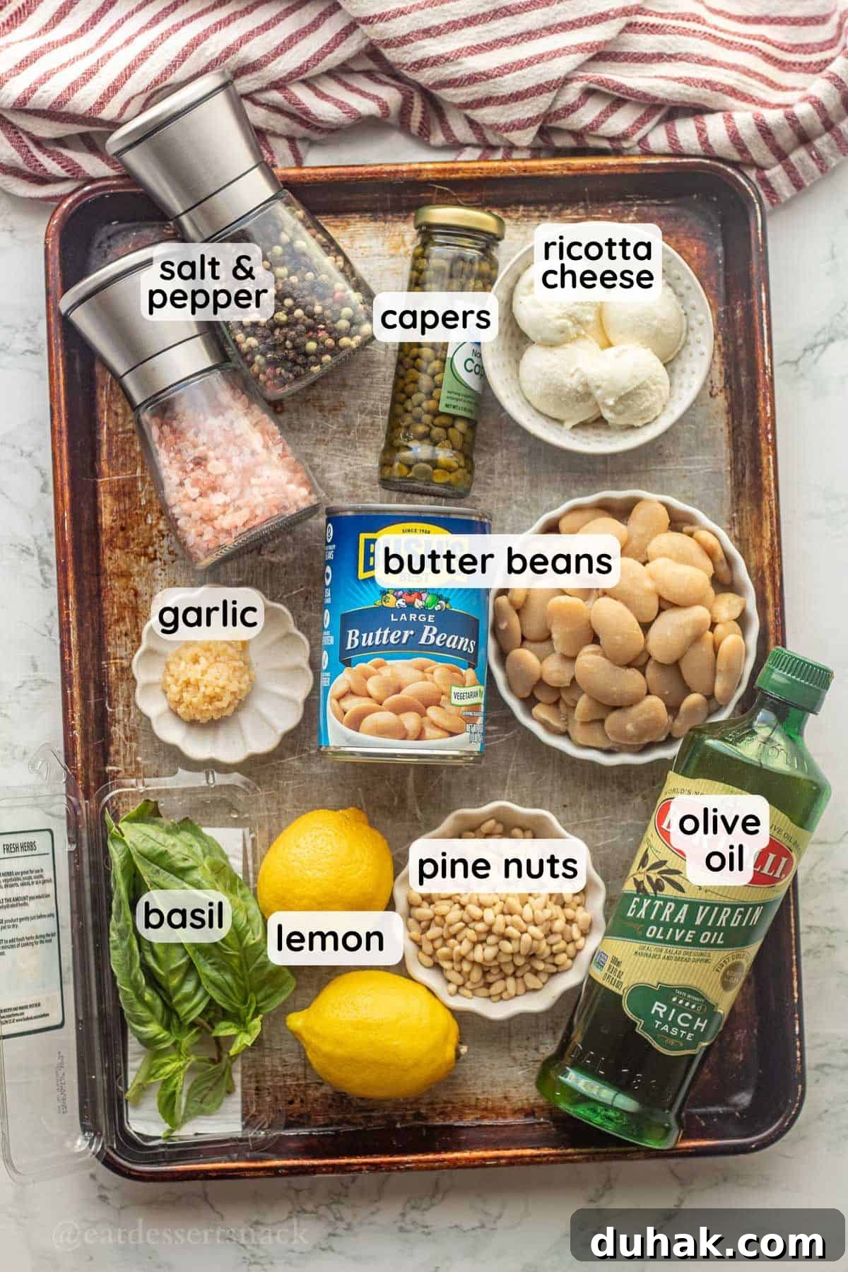 Creamy Ricotta and Butter Bean Salad with Lemon Herb Dressing 3 Labeled ingredients for butter bean salad in bowls on metal baking pan.