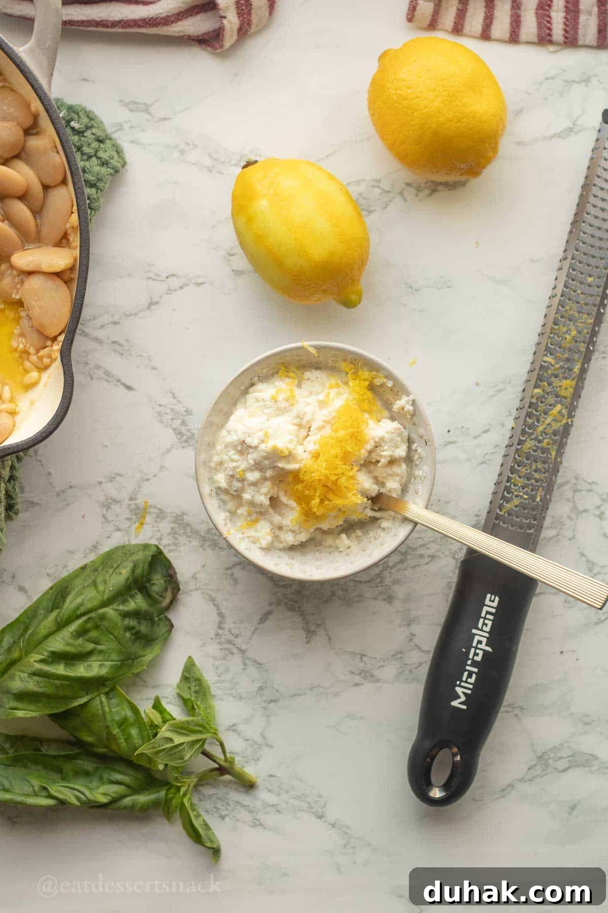 Creamy Ricotta and Butter Bean Salad with Lemon Herb Dressing 8 Ricotta with lemon zest and spoon in a bowl.