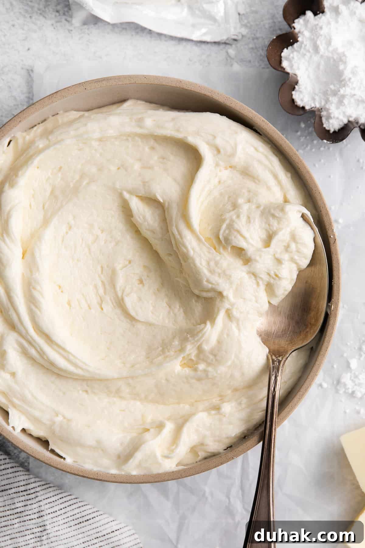 Cream cheese buttercream frosting in a bowl.