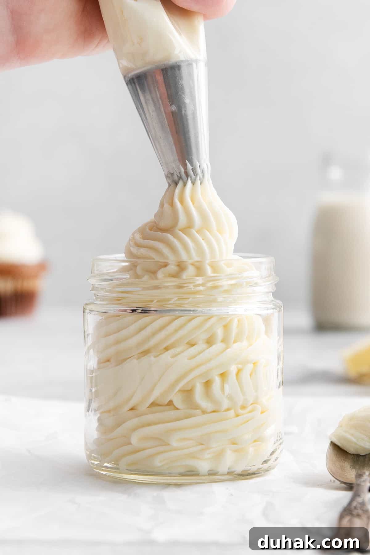 Cream cheese buttercream frosting in a jar.