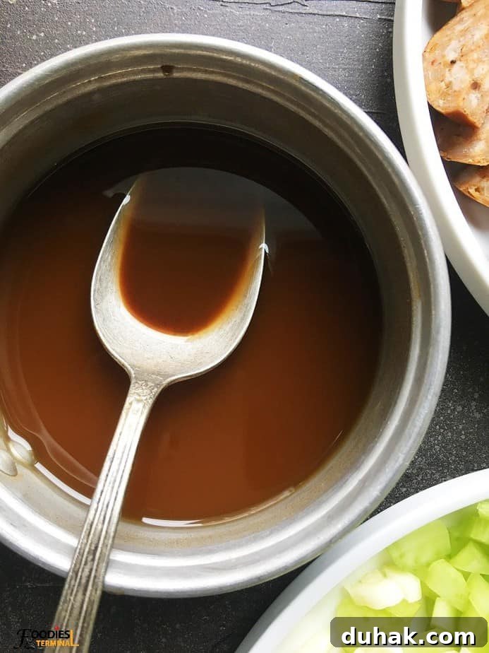 Gumbo base in a pot with spoon