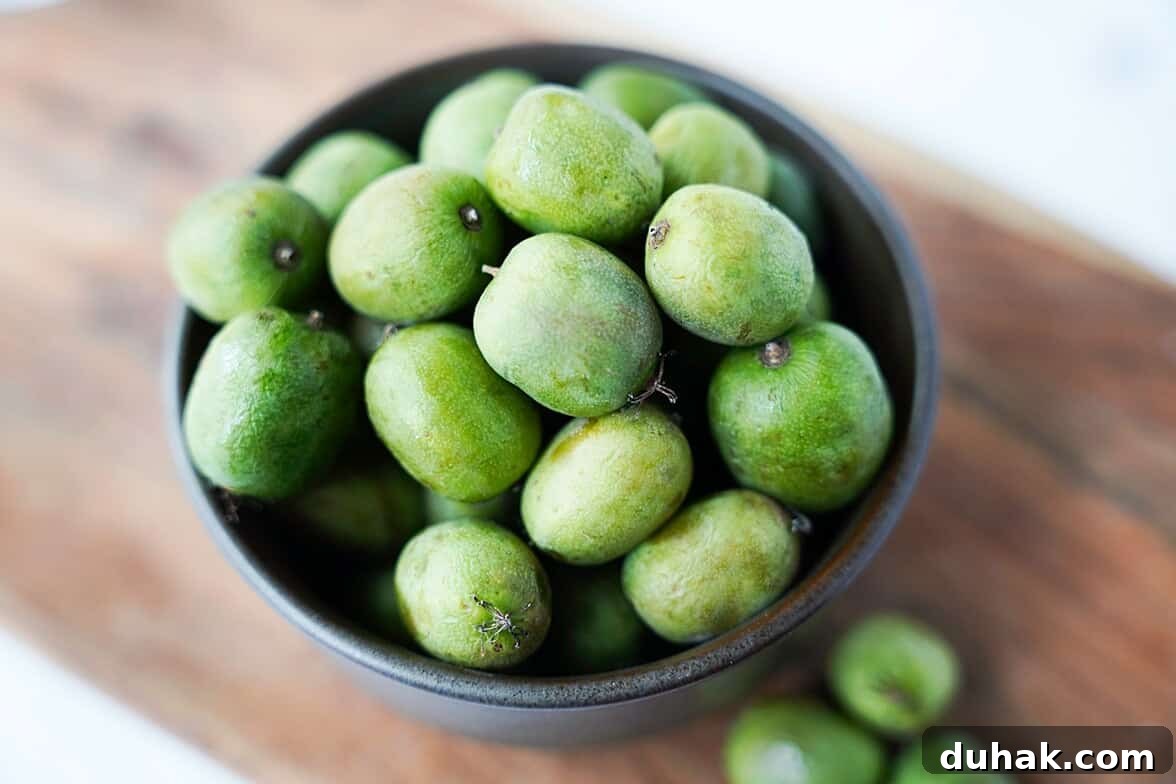 Kiwi Berries: Small Fruit Guide, Taste, Uses, and Benefits 2 a bowl of whole kiwi berries