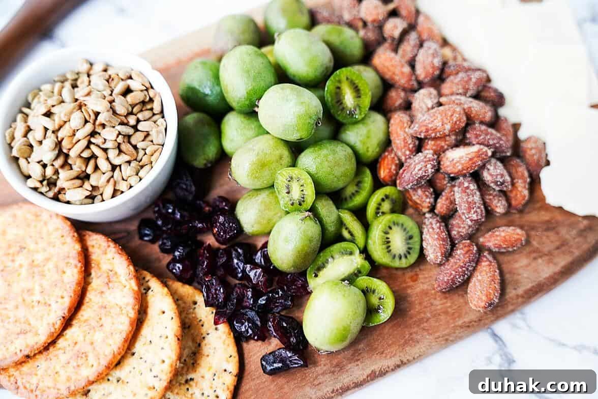 Kiwi Berries: Small Fruit Guide, Taste, Uses, and Benefits 7 Kiwi berries placed in the center of a charcuterie board