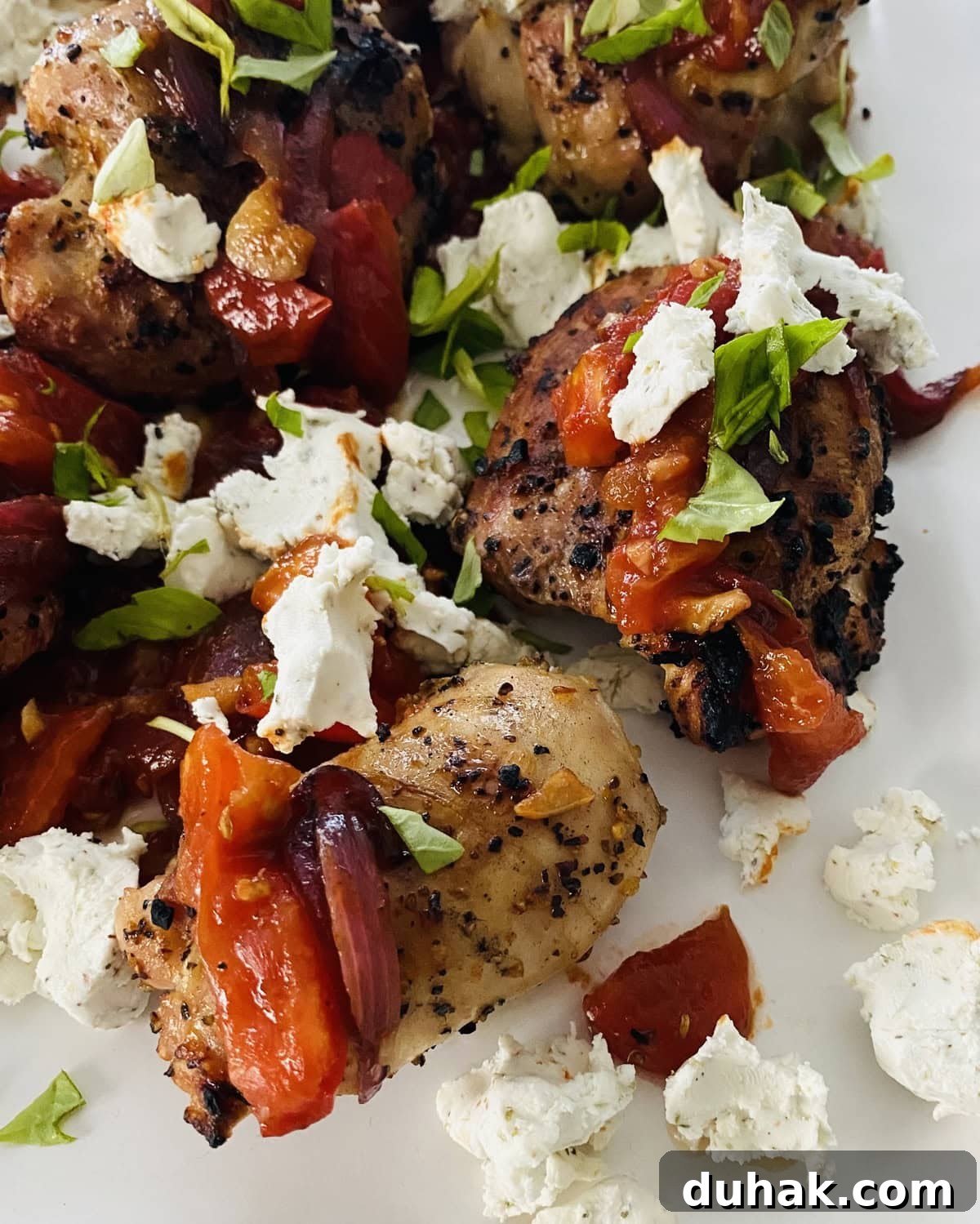 Grilled Chicken with Tomato Bruschetta and Goat Cheese 2 grilled chicken thighs with bruschetta and goat cheese