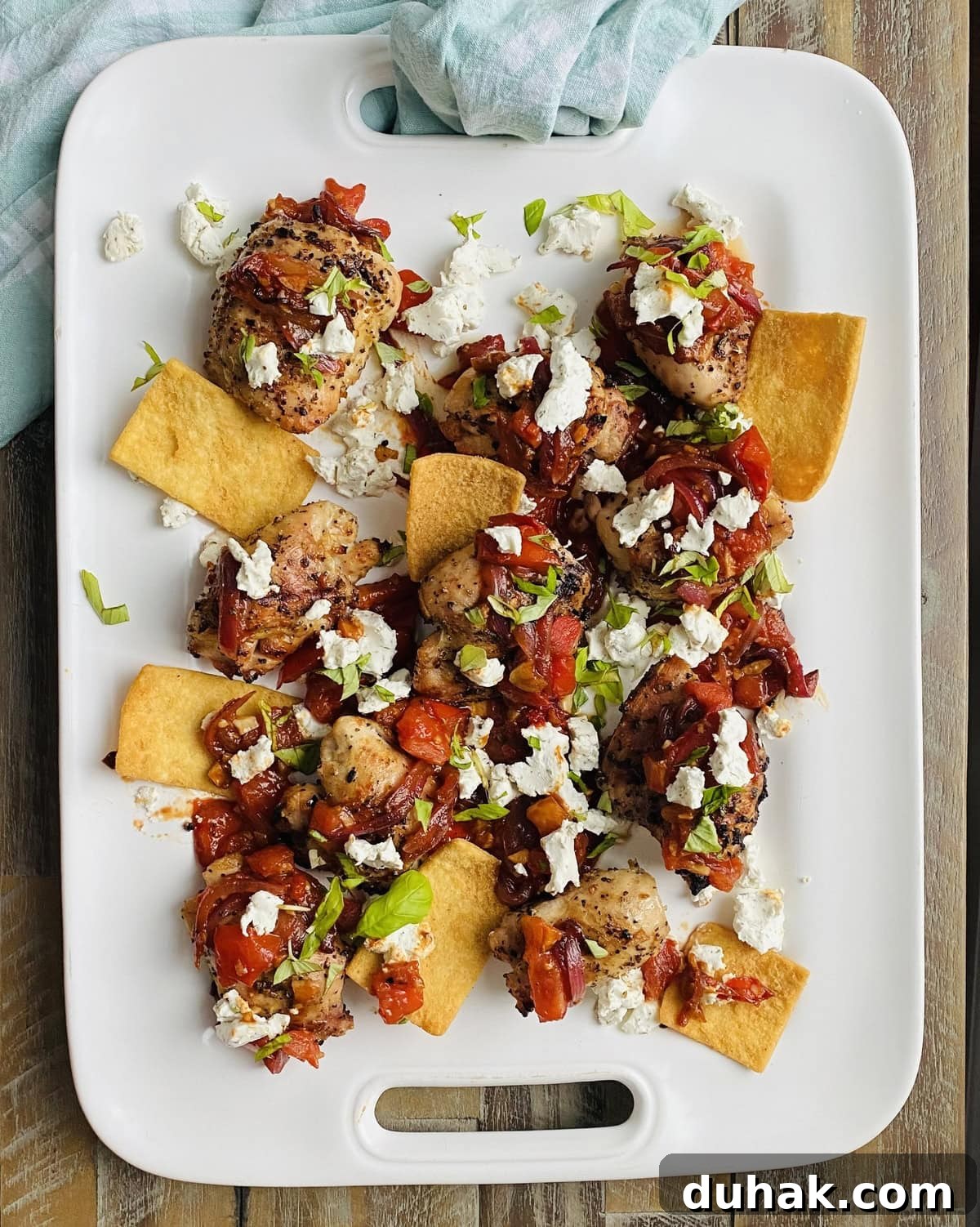 Grilled Chicken with Tomato Bruschetta and Goat Cheese 7 platter of grilled chicken thighs with sautéed bruschetta and goat cheese
