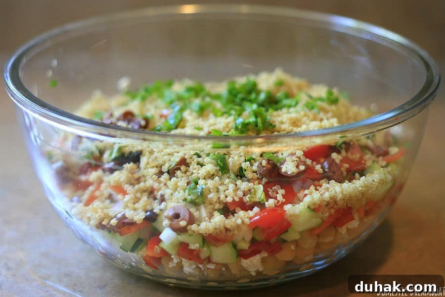 Greek Chickpea & Quinoa Salad with Feta and Lemon Dressing 3 Chickpea and quinoa salad in a glass bowl before mixing