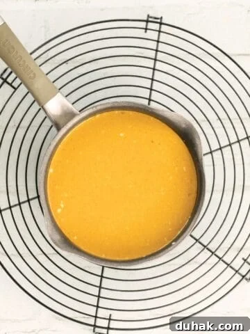 thai red curry sauce in a pot on a cooling rack