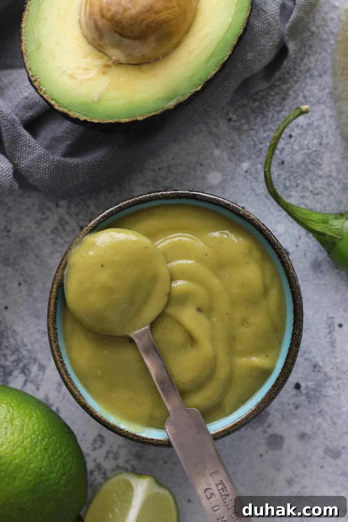Creamy Avocado Vegan Dressing Recipe for Salads & Bowls 2 Sauce in a Bowl with a Spoon