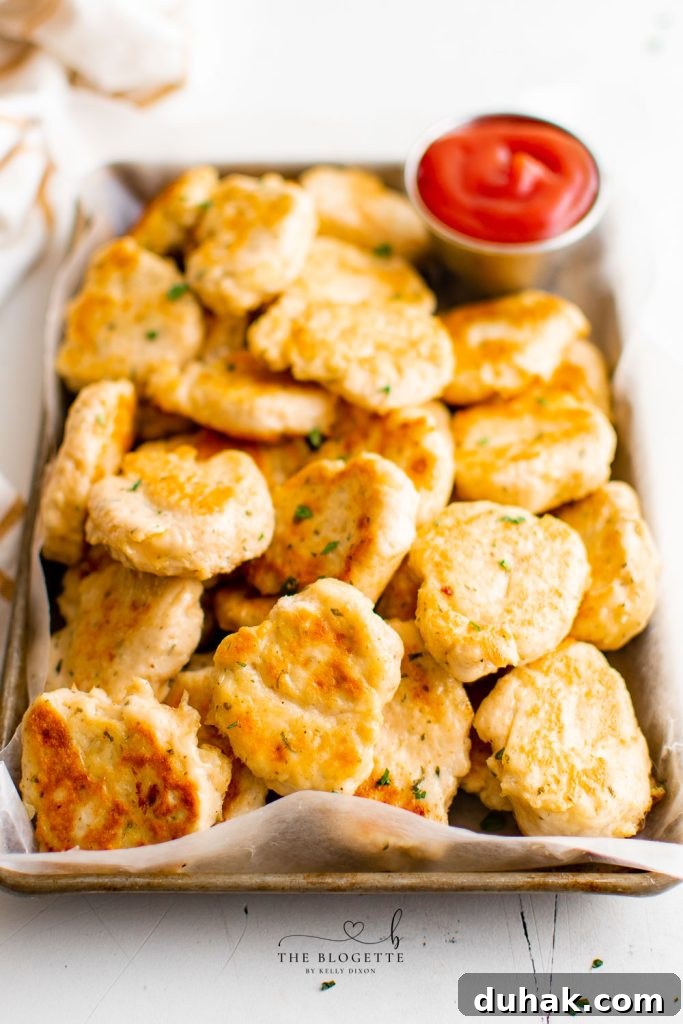 Homemade Chicken Nuggets that are not only healthier than McNuggets, but they're also addicting! Skip the drive-through for chicken McNuggets, because these are the BEST chicken nuggets you can make at home! 