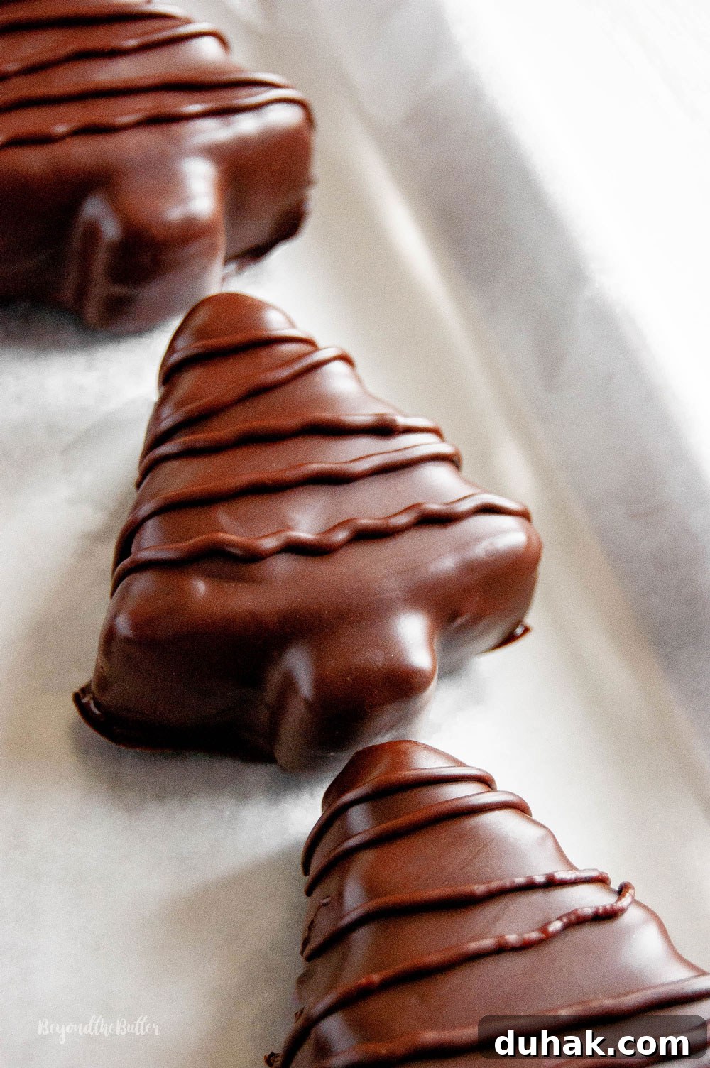 Chocolate-Covered Peanut Butter Christmas Tree Treats 4 Chocolate Covered Peanut Butter Christmas Trees | All Images © Beyond the Butter, LLC