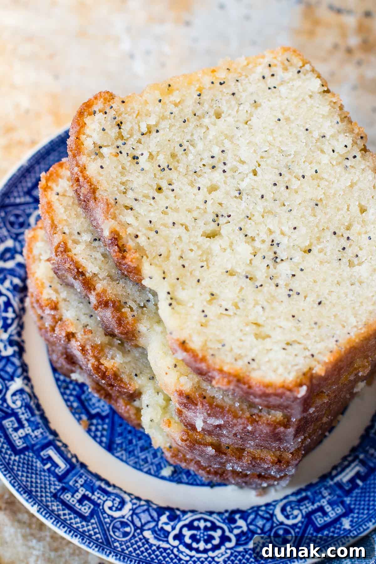 Glazed Poppy Seed Loaf with Video Tutorial 4 Poppy seed bread is all kinds of amazing on its own, but add an orange glaze for something special