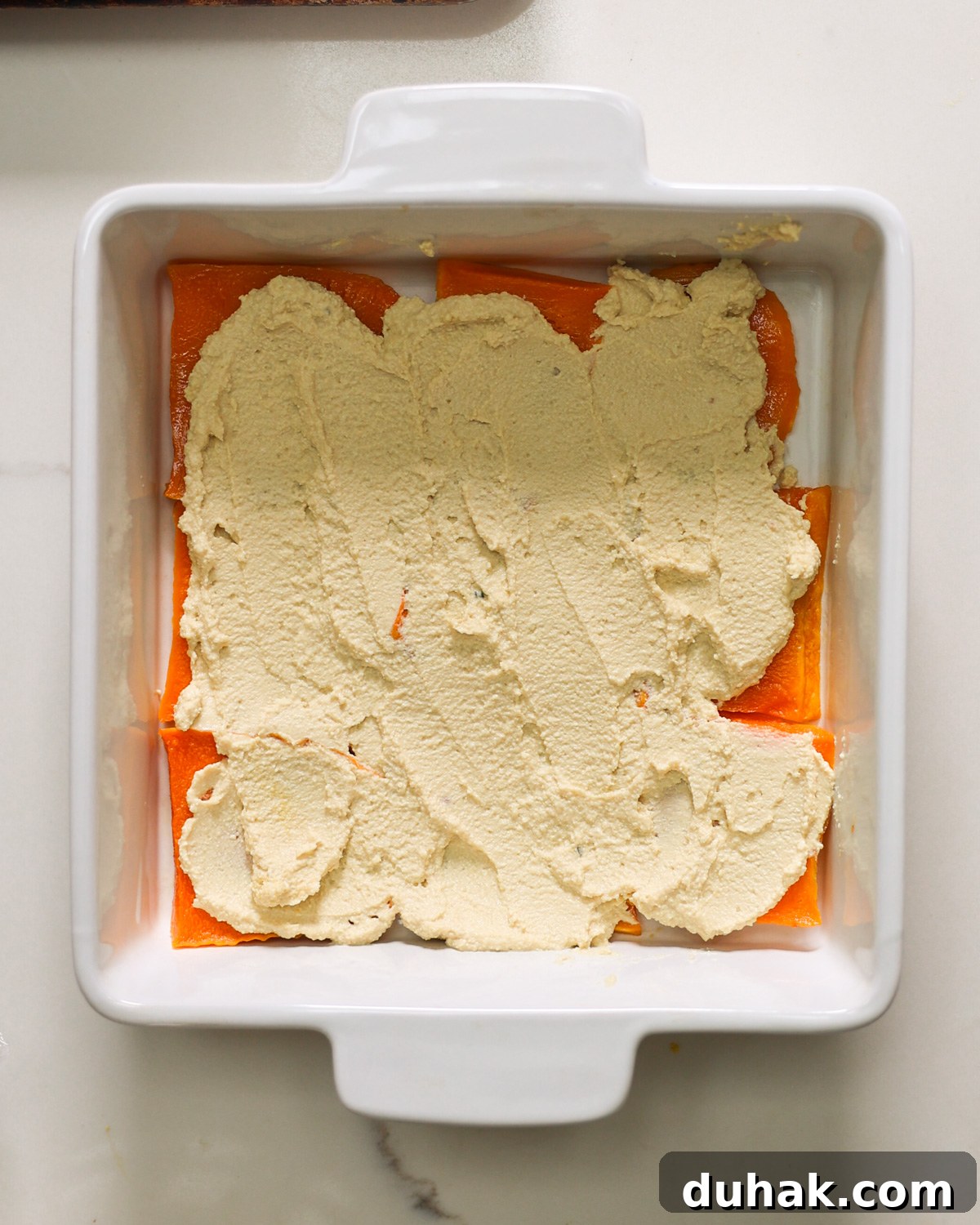 overhead layering butternut squash lasagna 