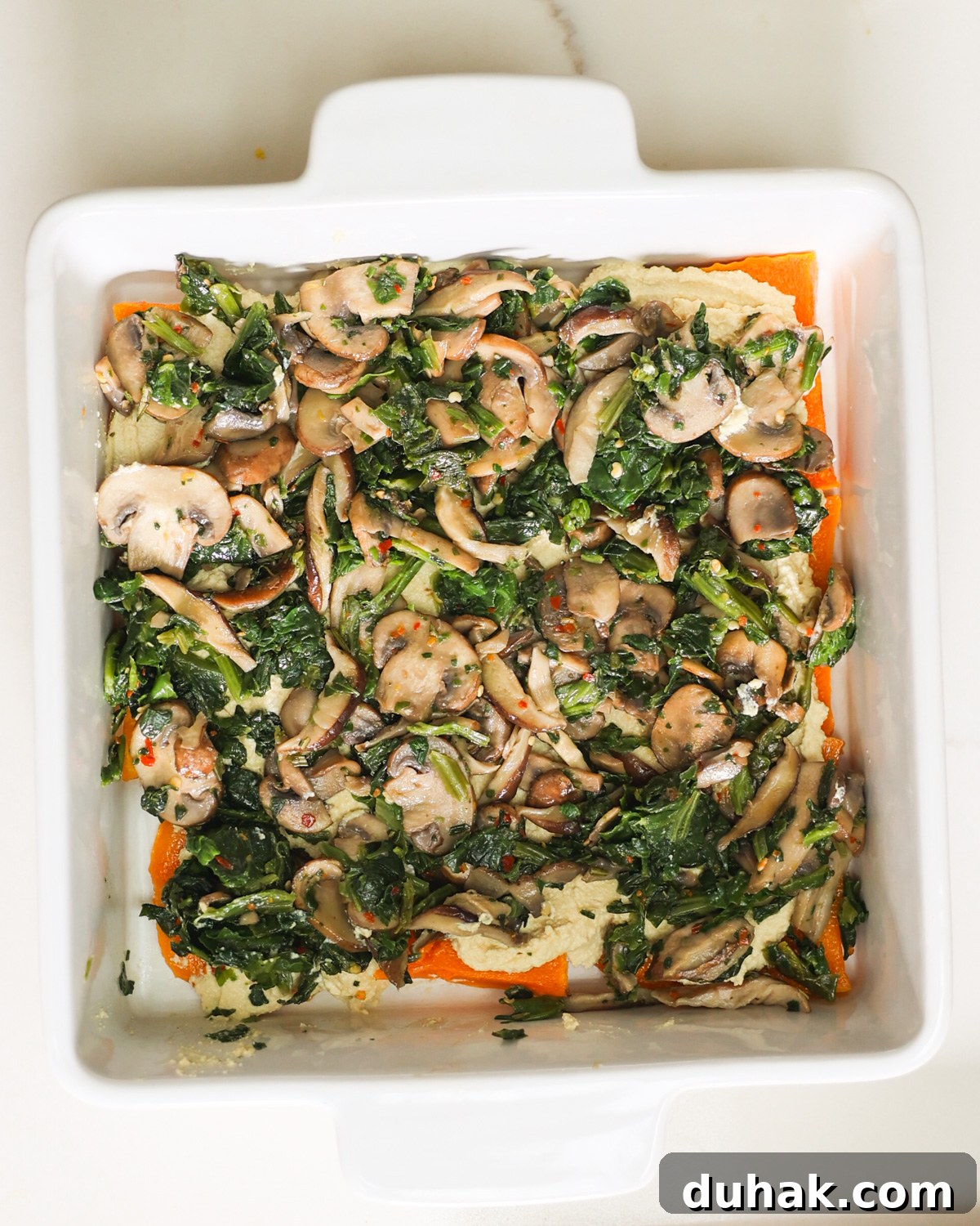 spinach and mushrooms added to lasagna
